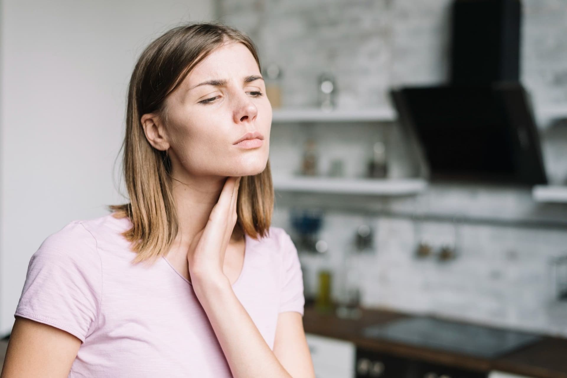 Why does my throat hurt while yawning?